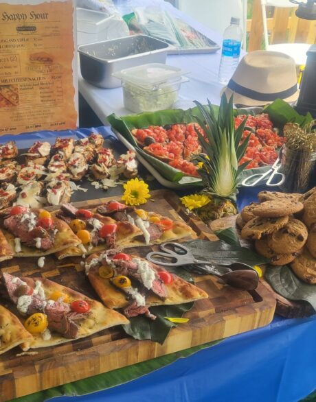 A table filled with various delicious-looking appetizers and finger foods.