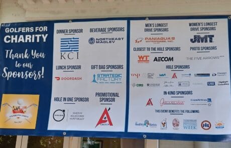 A large signboard lists various licensed contractors and service providers.