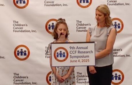 Two women speaking at a 2022 annual conference podium.